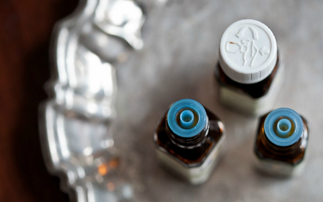 essential oil bottles sitting on a silver tray