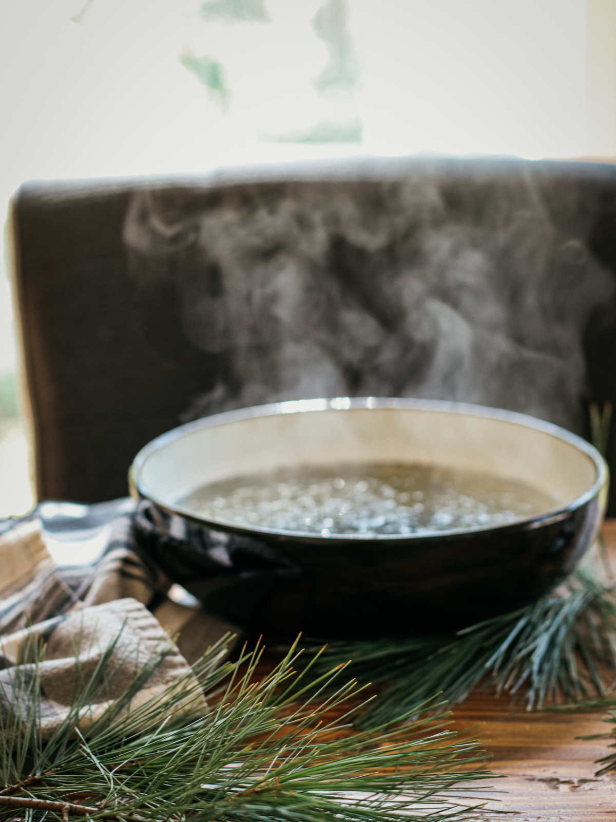 steam coming from bowl of herbs