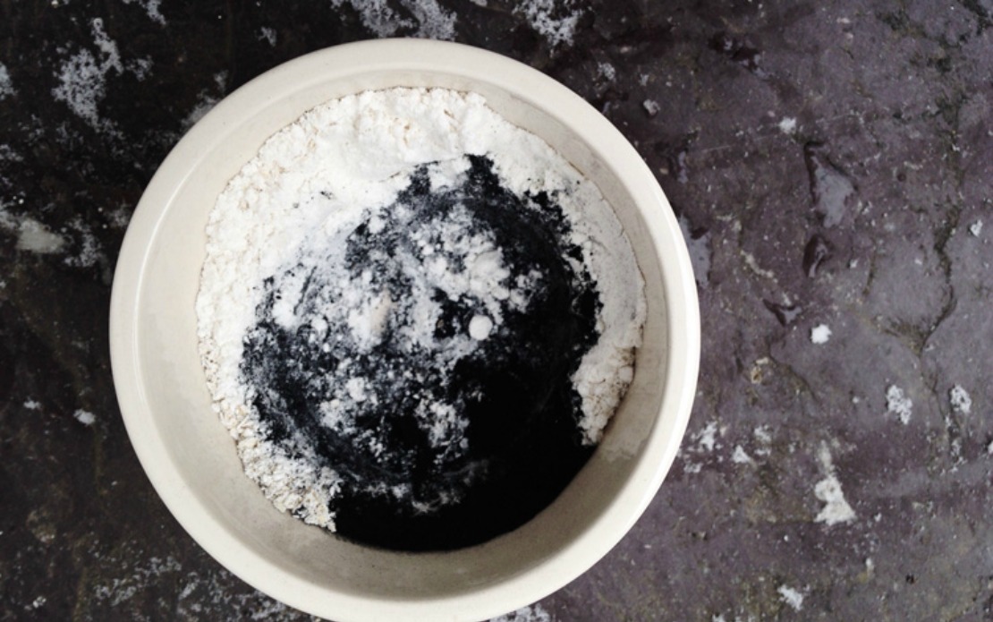 bowl of powdered herbs for a detox mask