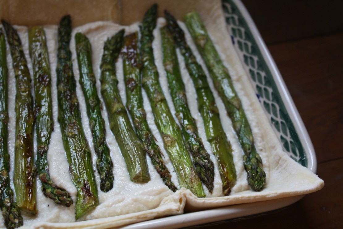 Asparagus Tart with Pear Cream Ricotta and Balsamic Date Glaze | Herbal Academy | Asparagus is in full bloom this time of the year. Here's a simple, dairy-free roasted asparagus with pear and tofu cream sauce and a tangy balsamic glaze!