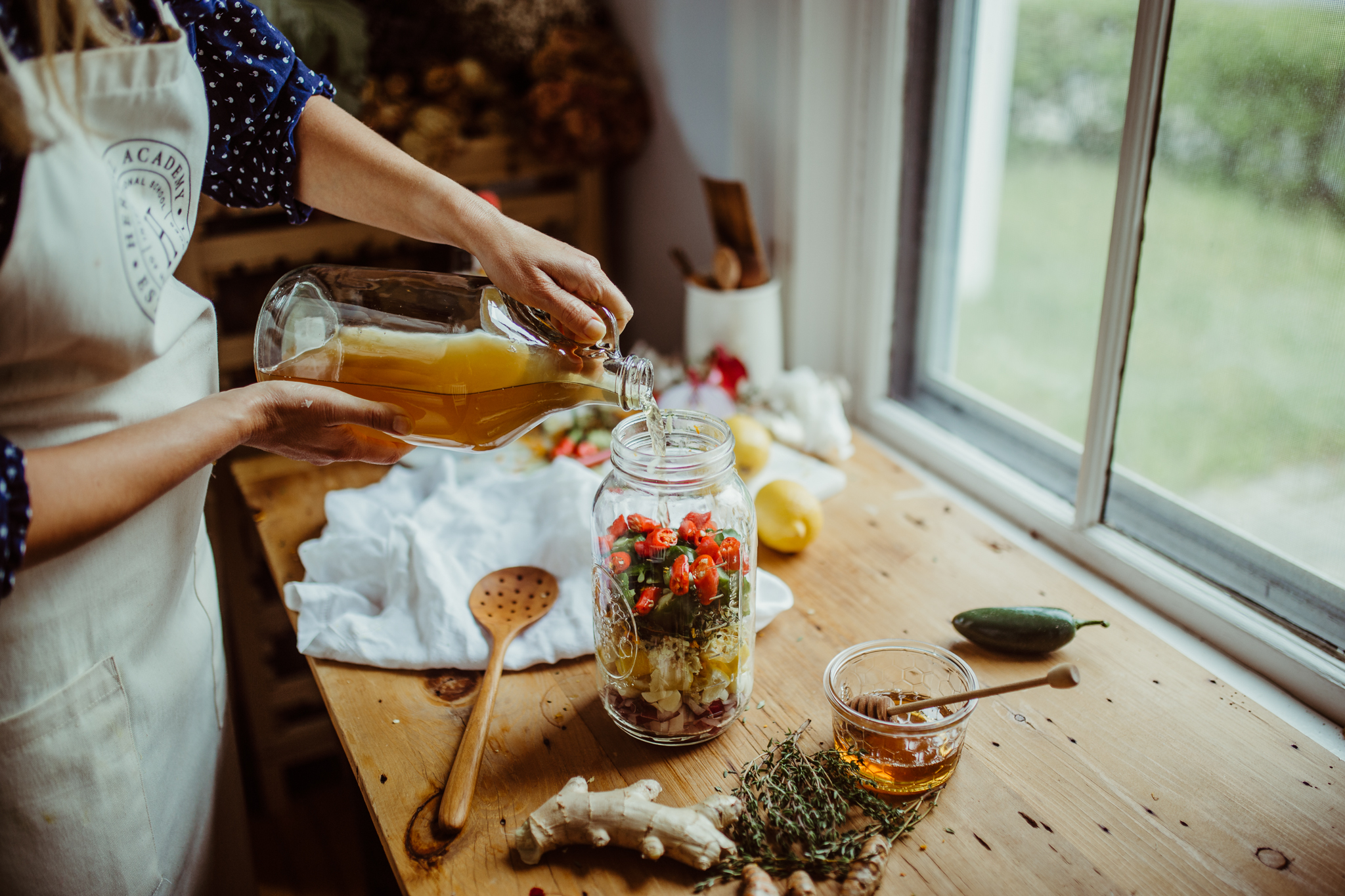 How To Make Homemade Fire Cider | Herbal Academy | 'Tis the season to make homemade fire cider! A shot glass of this a day is a great defense against colds and flu, and it also acts as a decongestant!