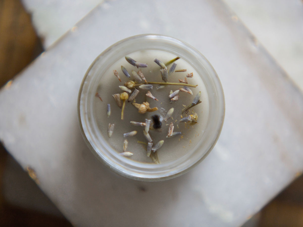 DIY Hand Poured Herbal Candles | Herbal Academy | Are you looking for a simple way to enjoy the ambiance of candlelight without all the chemicals? Try making your own hand poured herbal candles instead!