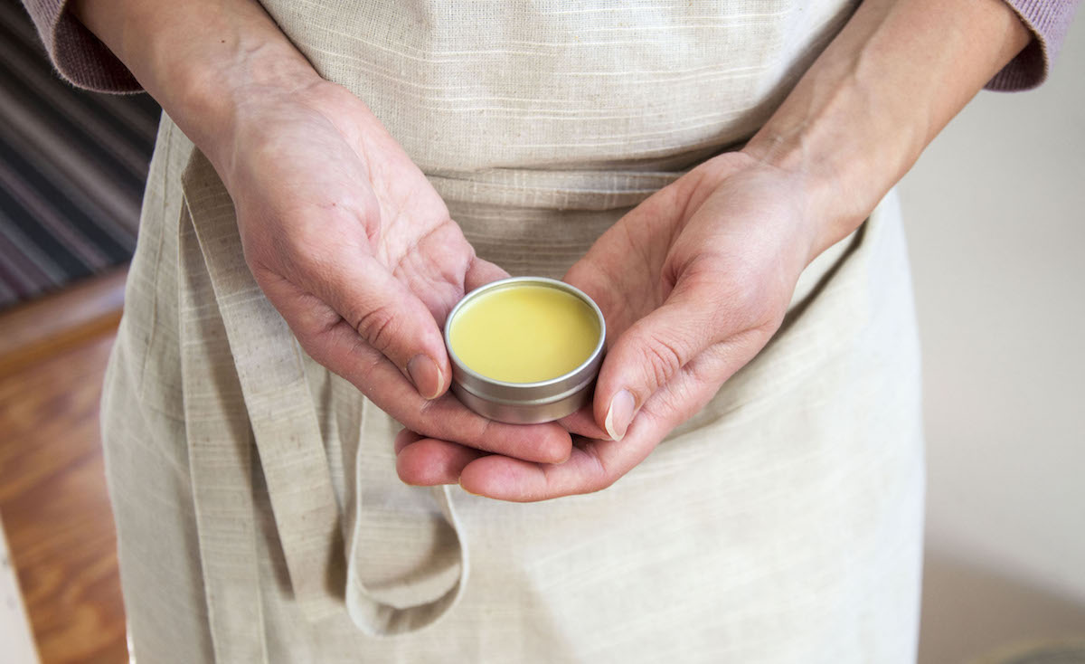 holding herbal salve