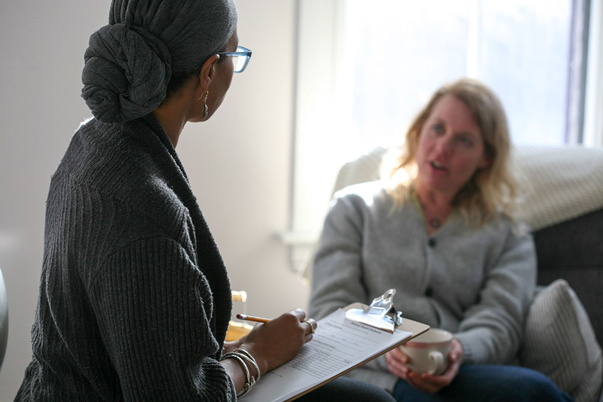 herbalist assessing the needs of a patient