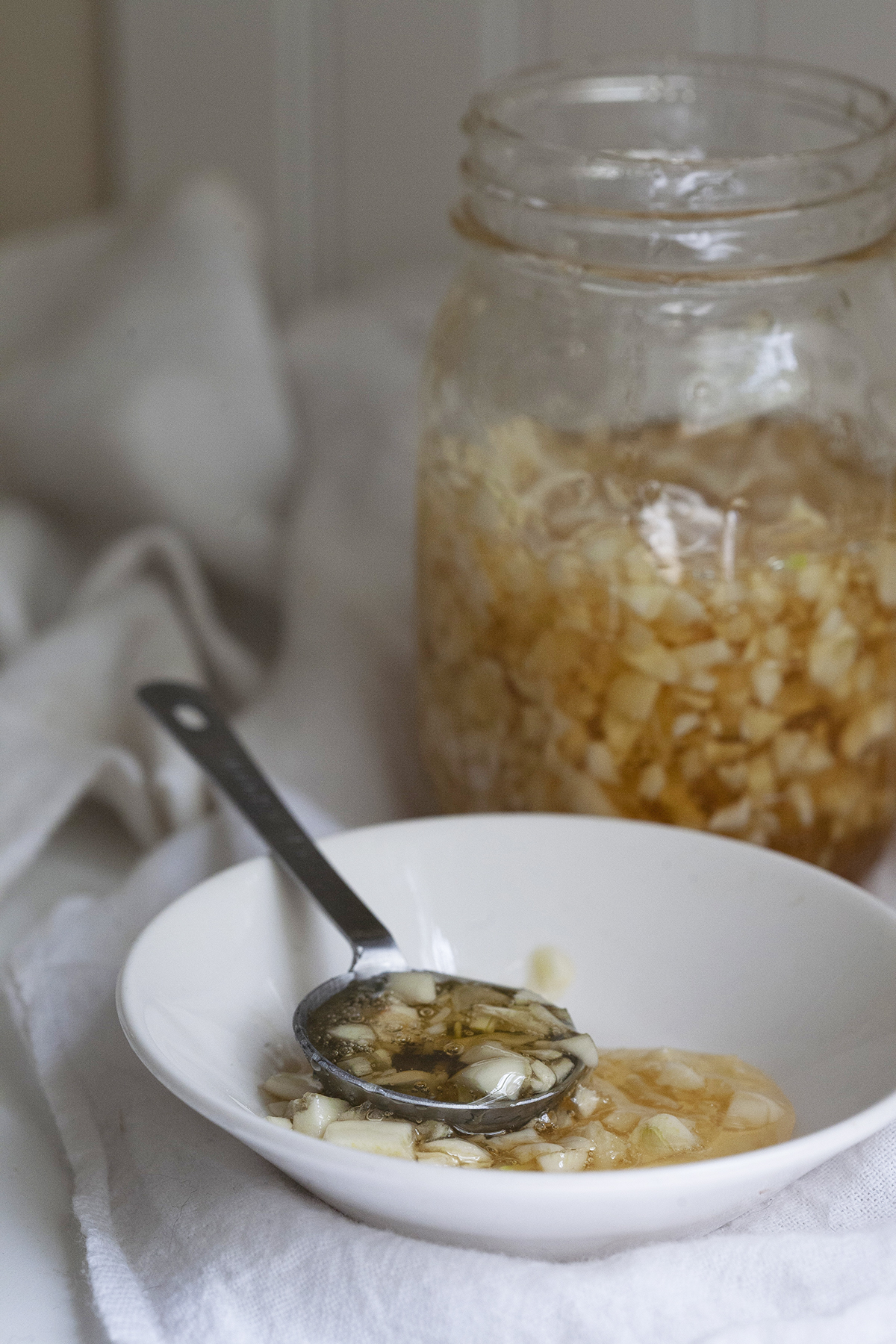 DIY Garlic Honey for For Cold & Flu Season Preparation | Herbal Academy | It’s easy to feel defenseless against unseen pathogens during cold and flu season, but having some garlic honey on hand will help you to be better prepared! 