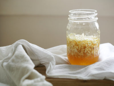 DIY Garlic Honey for For Cold & Flu Season Preparation | Herbal Academy | It’s easy to feel defenseless against unseen pathogens during cold and flu season, but having some garlic honey on hand will help you to be better prepared!