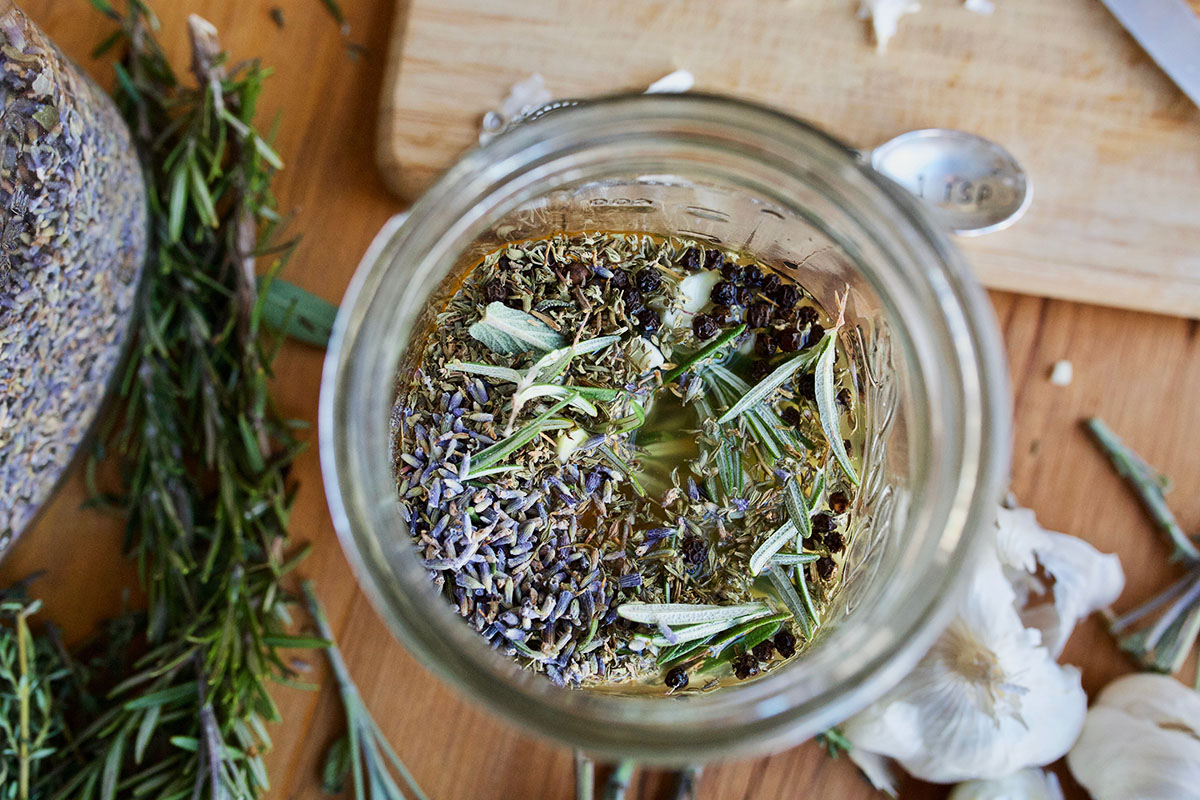 jar of herbs to make vinegar blend