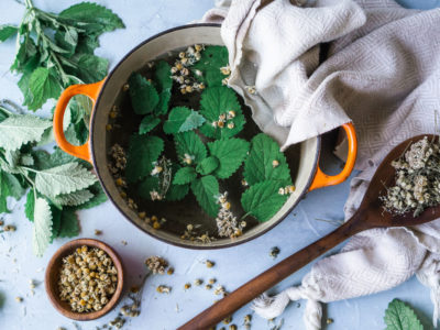 Try A Cooling Herbal Compress for Hot Summer Days | Herbal Academy | One way to keep the heat at bay while enjoying summer weather is to make a cooling herbal compress from herbs like peppermint, yarrow, and chamomile.