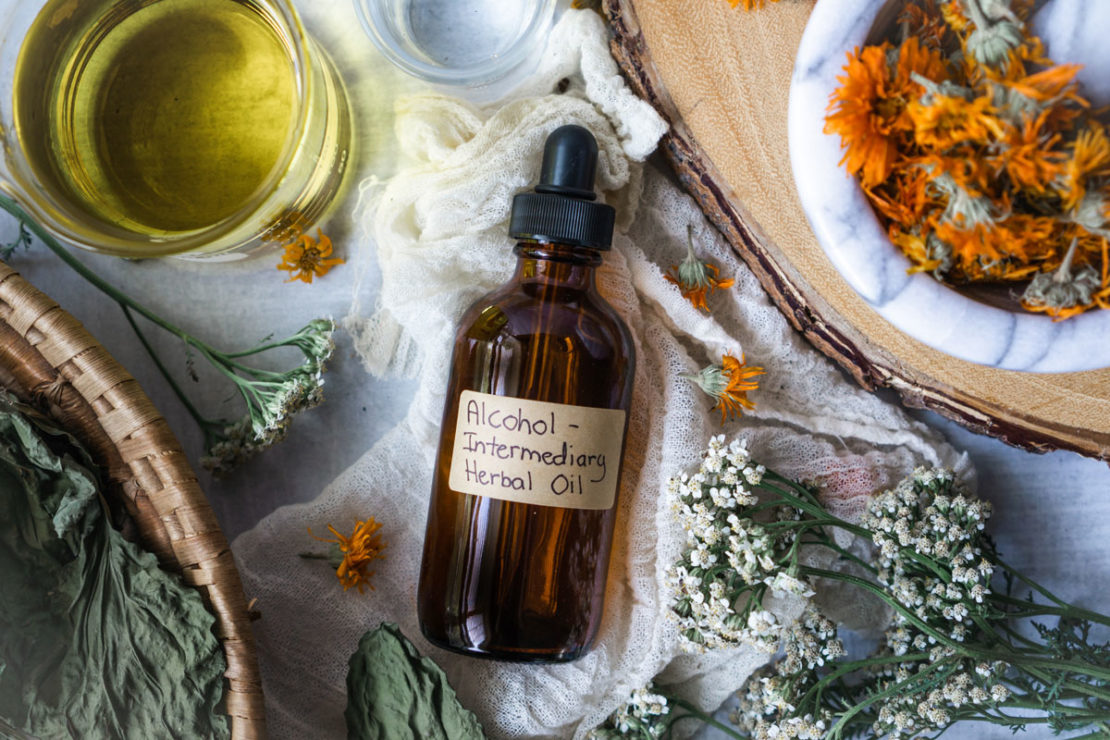 How to Make Alcohol Intermediary Herb-Infused Oils | Herbal Academy | With alcohol intermediary herb-infused oils you can save time, increase the shelf life of your oils, and create a stronger finished oil.