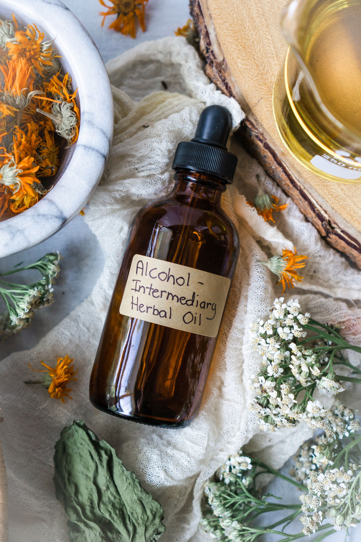 How to Make Alcohol Intermediary Herb-Infused Oils | Herbal Academy | With alcohol intermediary herb-infused oils you can save time, increase the shelf life of your oils, and create a stronger finished oil. 