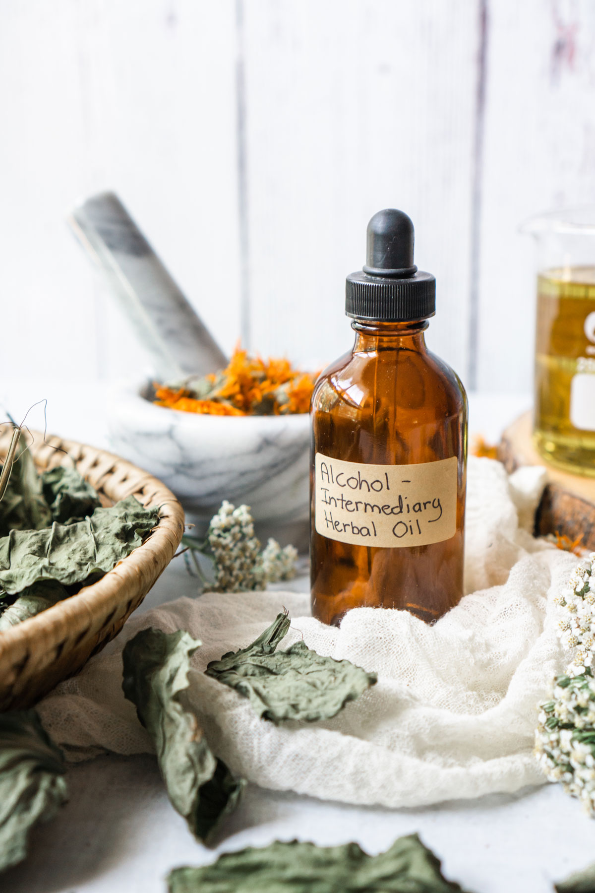 How to Make Alcohol Intermediary Herb-Infused Oils | Herbal Academy | With alcohol intermediary herb-infused oils you can save time, increase the shelf life of your oils, and create a stronger finished oil. 
