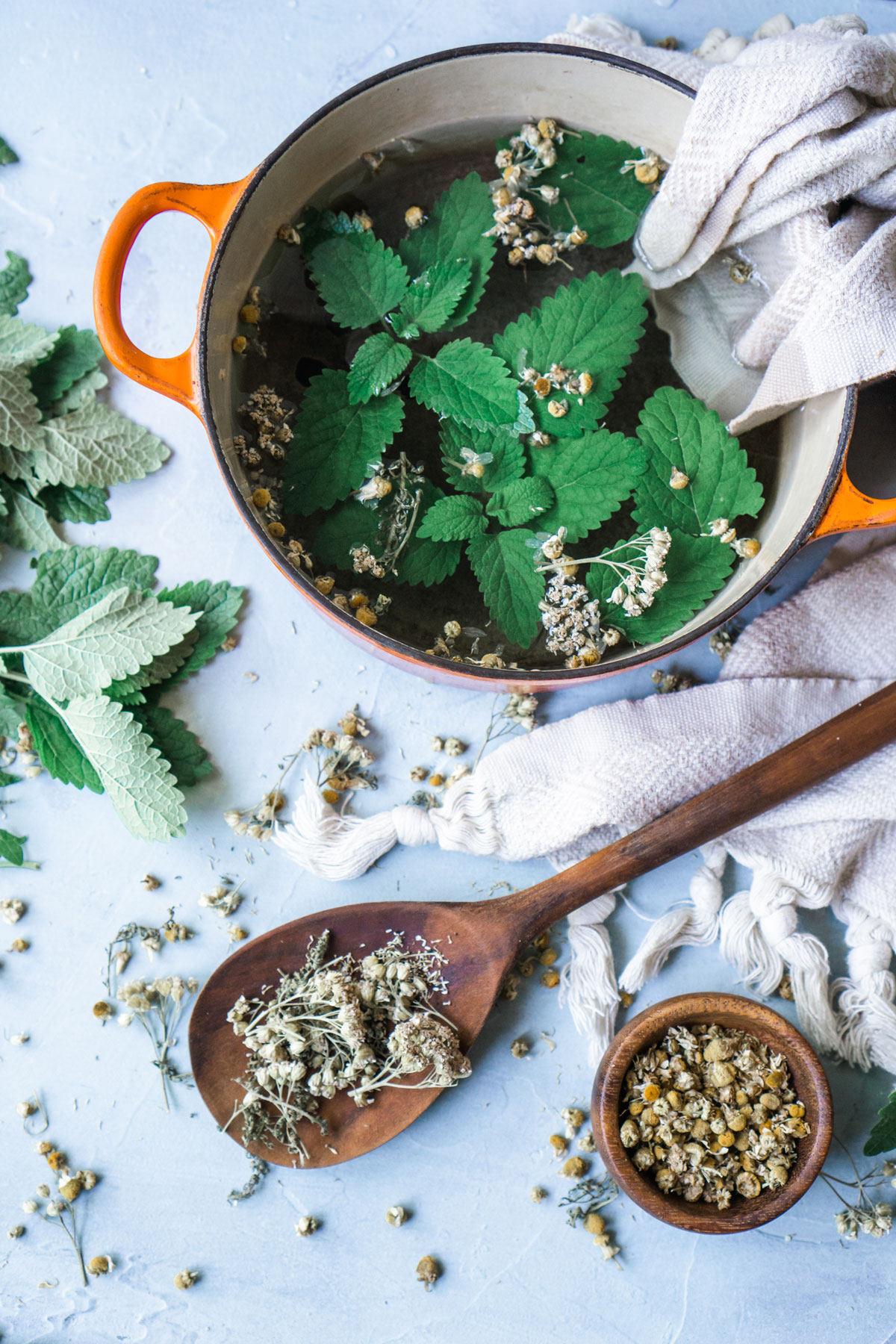 Try A Cooling Herbal Compress for Hot Summer Days | Herbal Academy | One way to keep the heat at bay while enjoying summer weather is to make a cooling herbal compress from herbs like peppermint, yarrow, and chamomile.