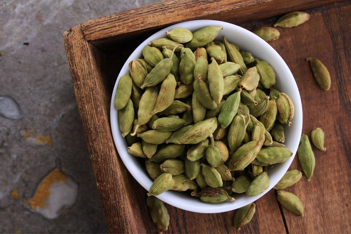 cardamom seeds in a white bowl