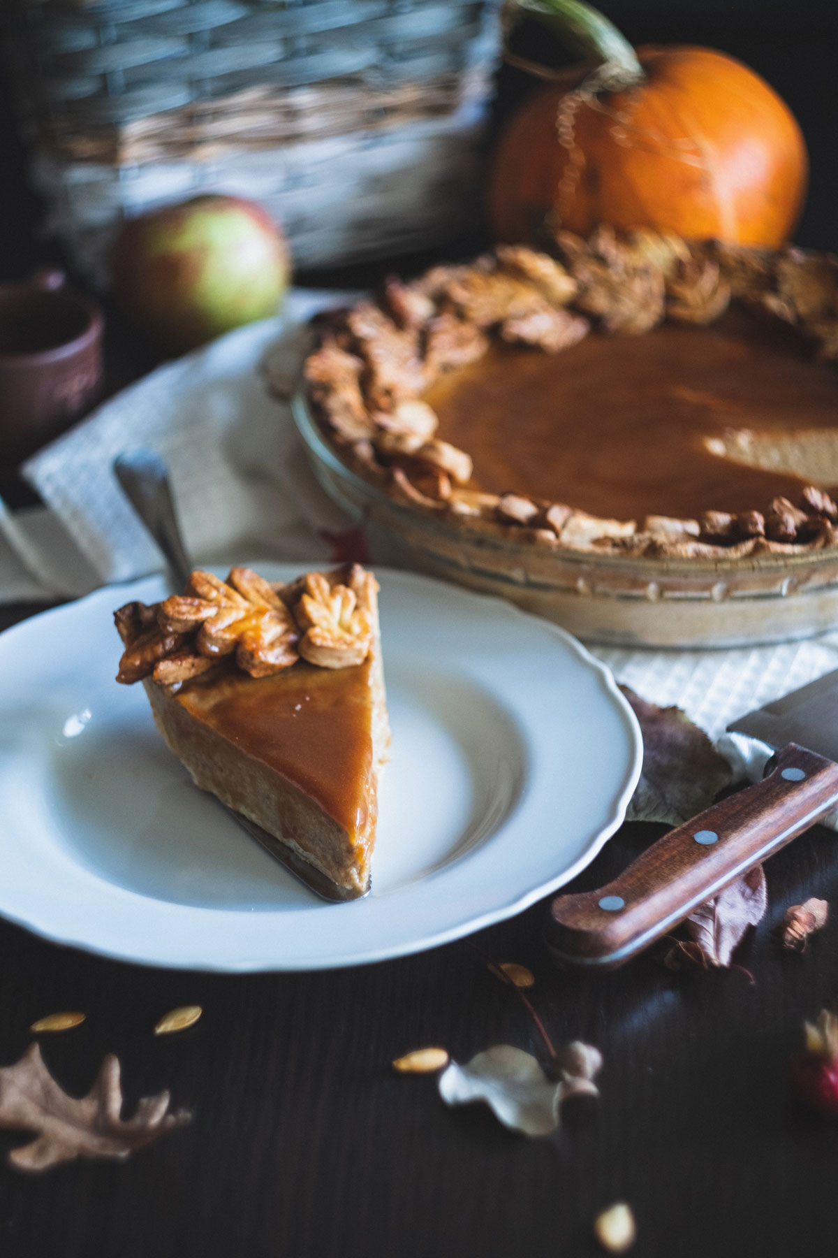 Pumpkin pie on a white plate - one of our favorite herbal desserts