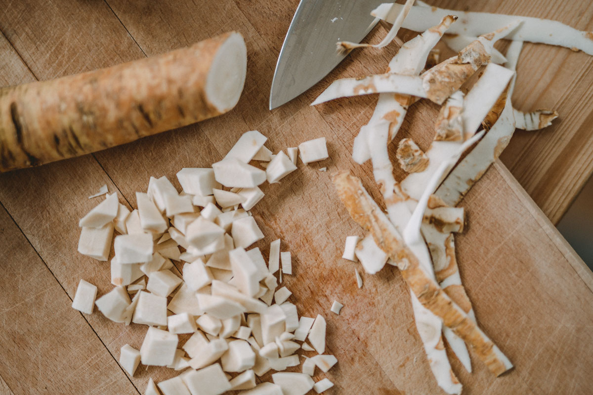 Fresh horseradish root on a cutting board