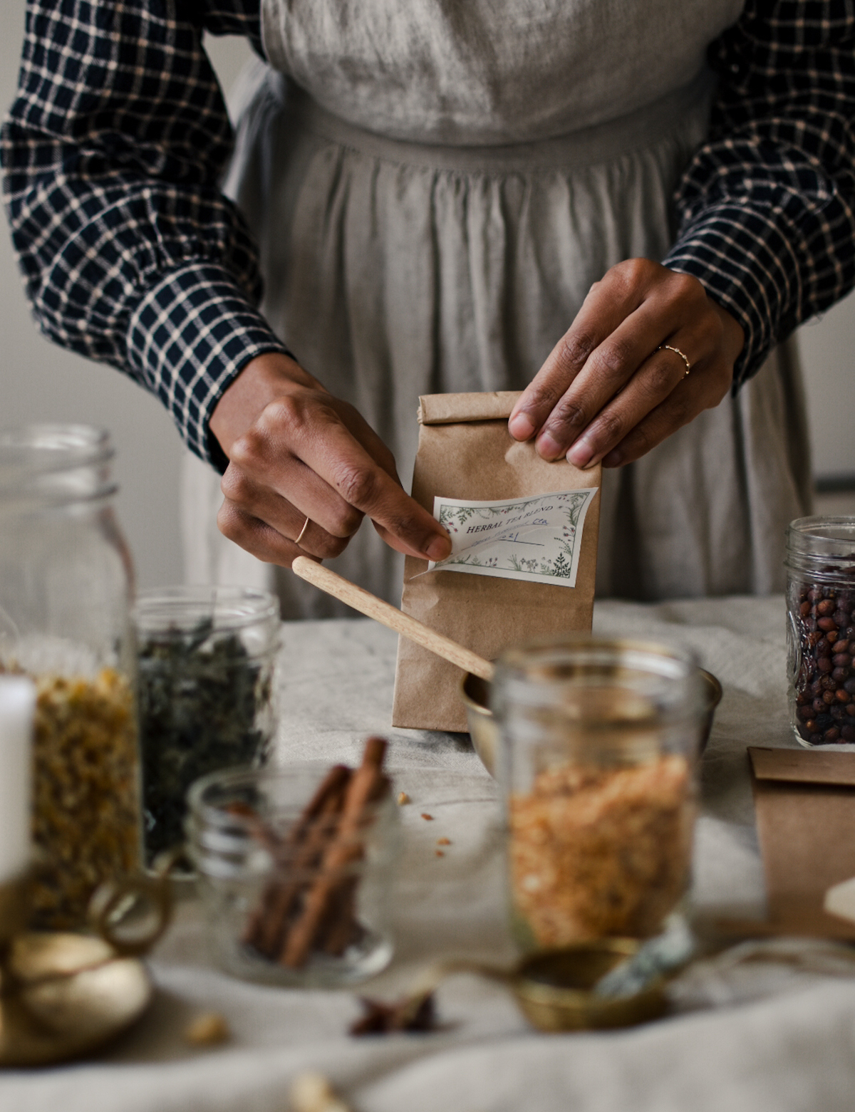 woman making herbal mixes