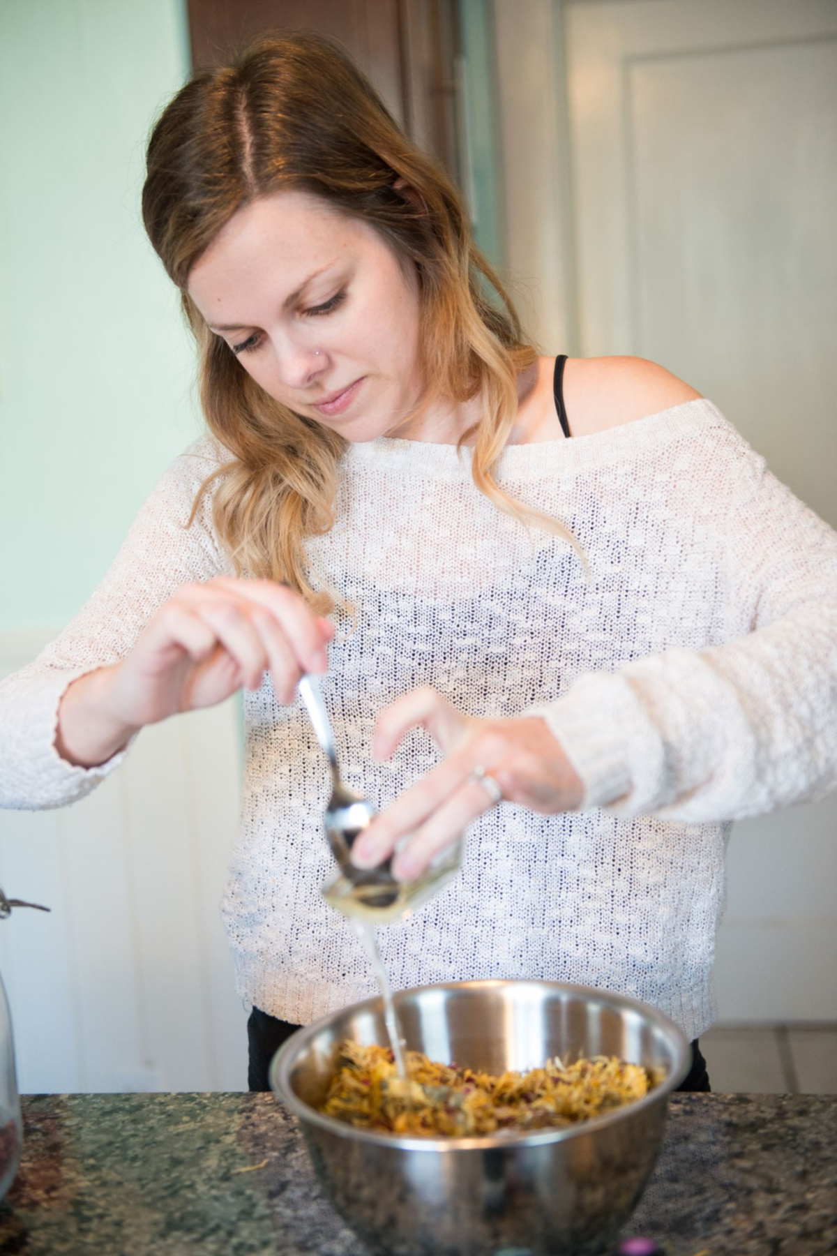 Chelsea Stephens making an herbal preparation