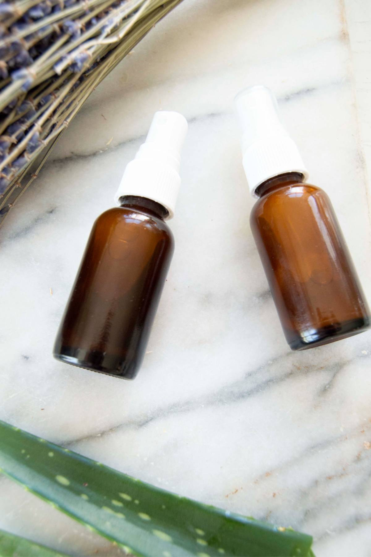 spray bottles on a table ready for teenage skin care 