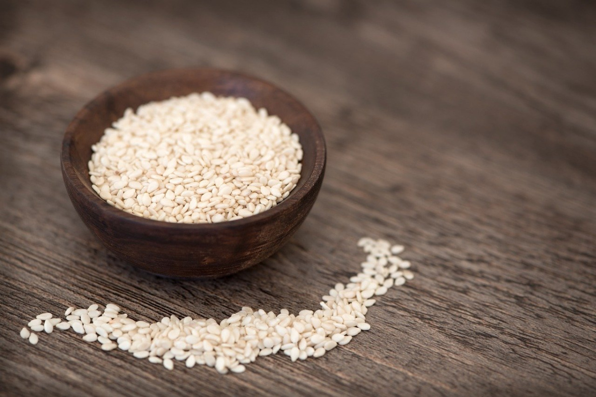 sesame seeds in a wooden bowl for nourishing herbs