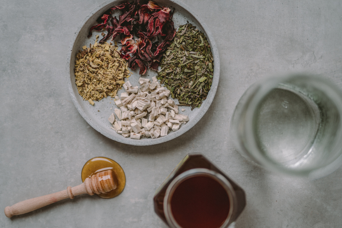 dried herbs and honey ready for dry cough syrup recipe