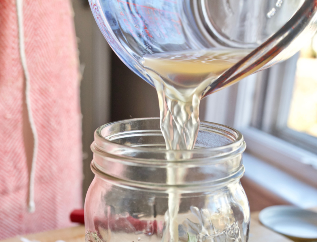 Pouring vinegar into a jar