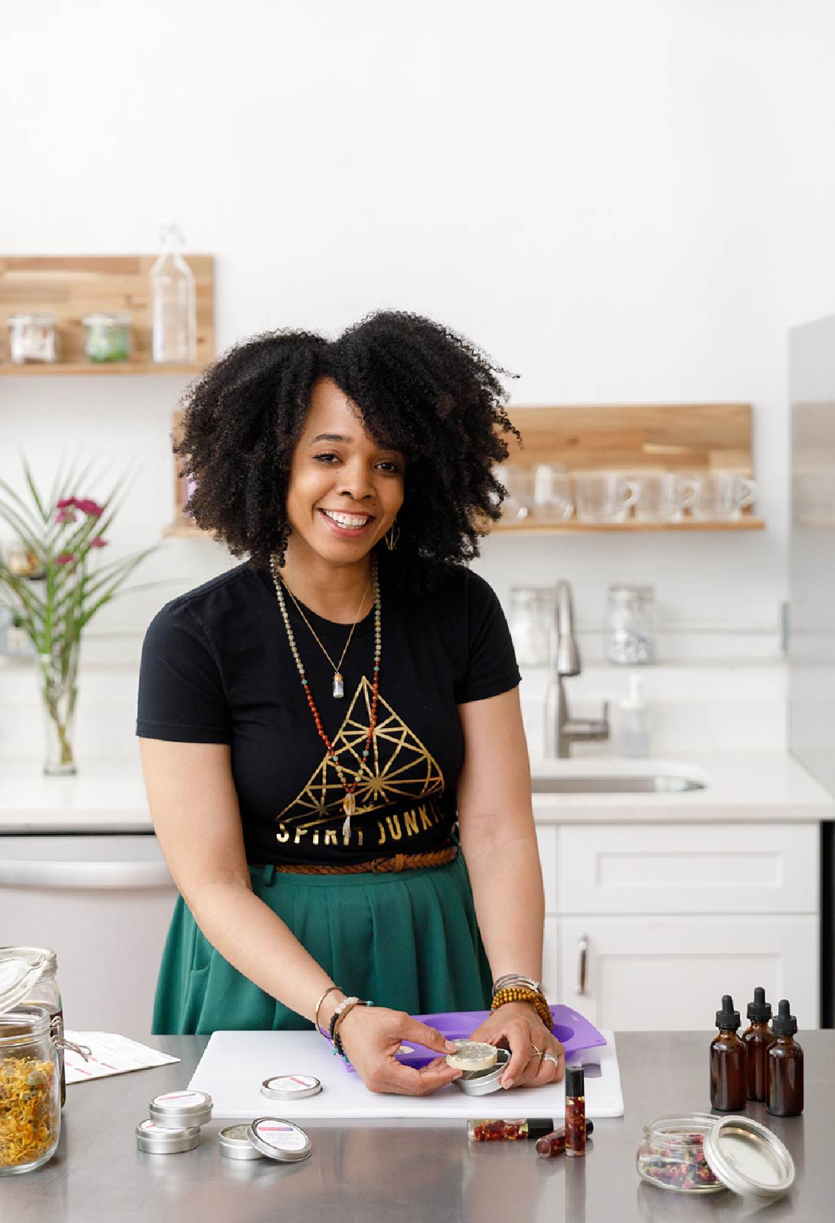 Kendra Payne making herbal preparations in her herb store