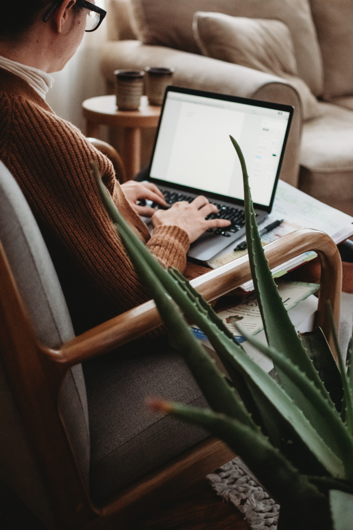 herbalist typing on laptop