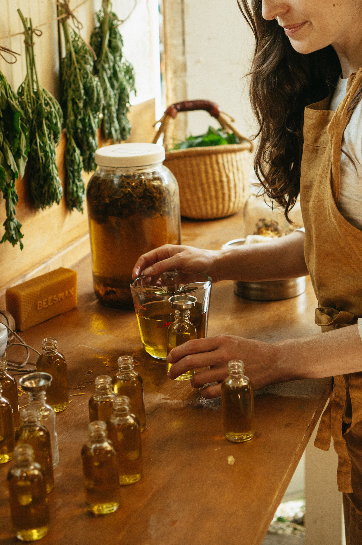 woman bottling oils