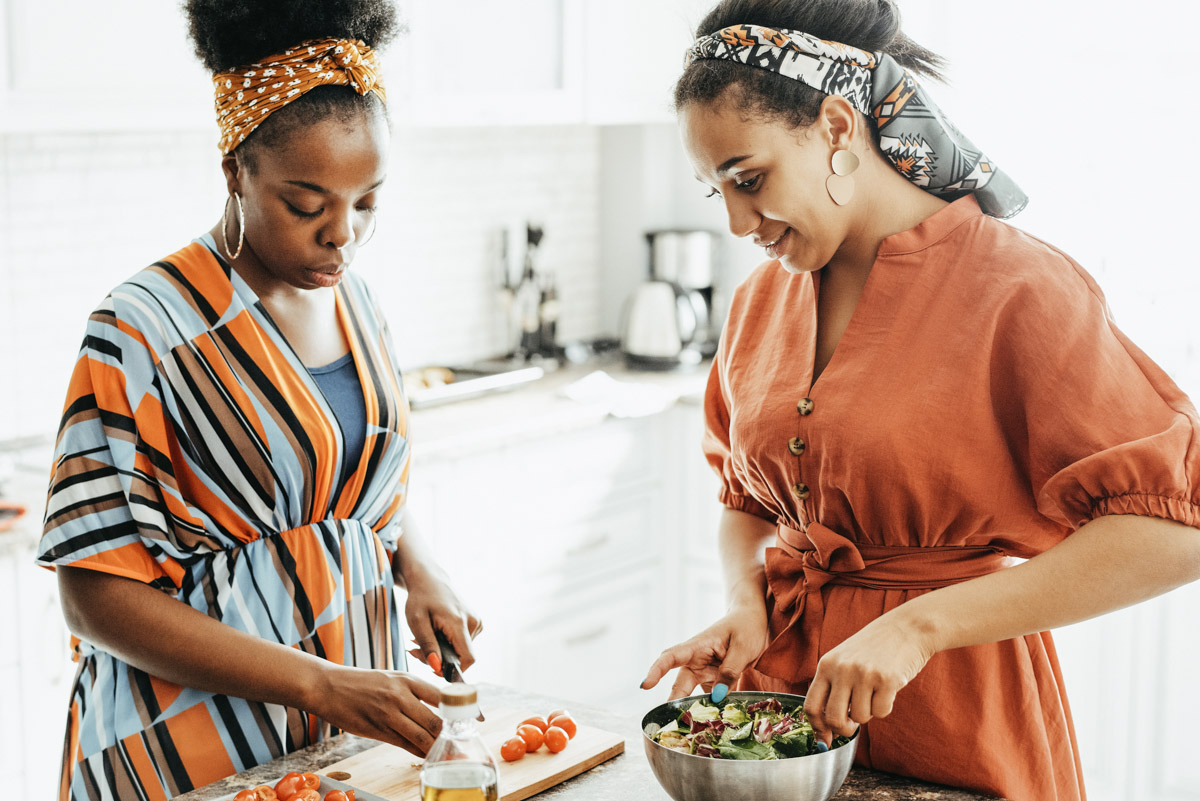 two women cooking together