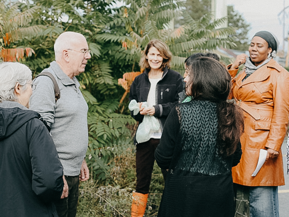 group of people talking outside