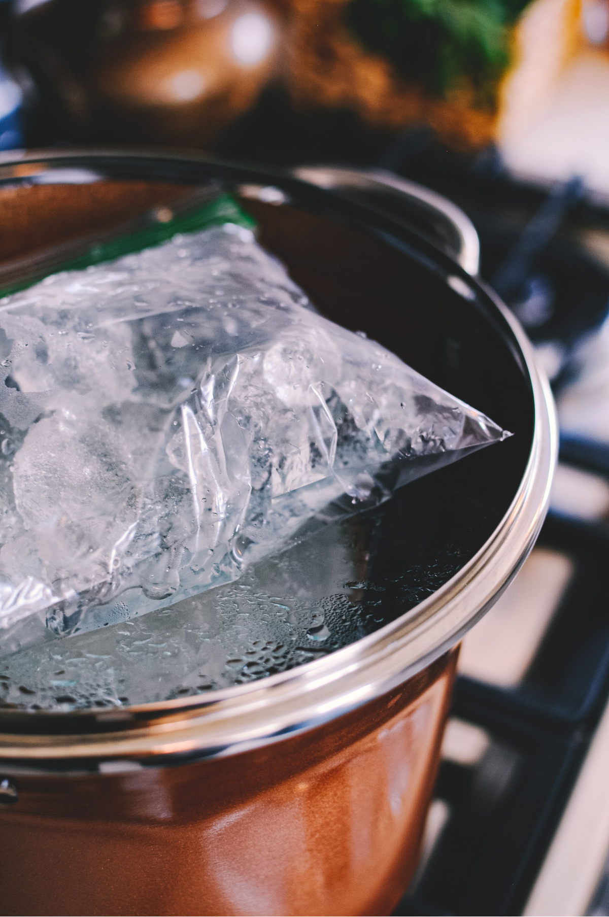 bag of ice melting on a pot lid