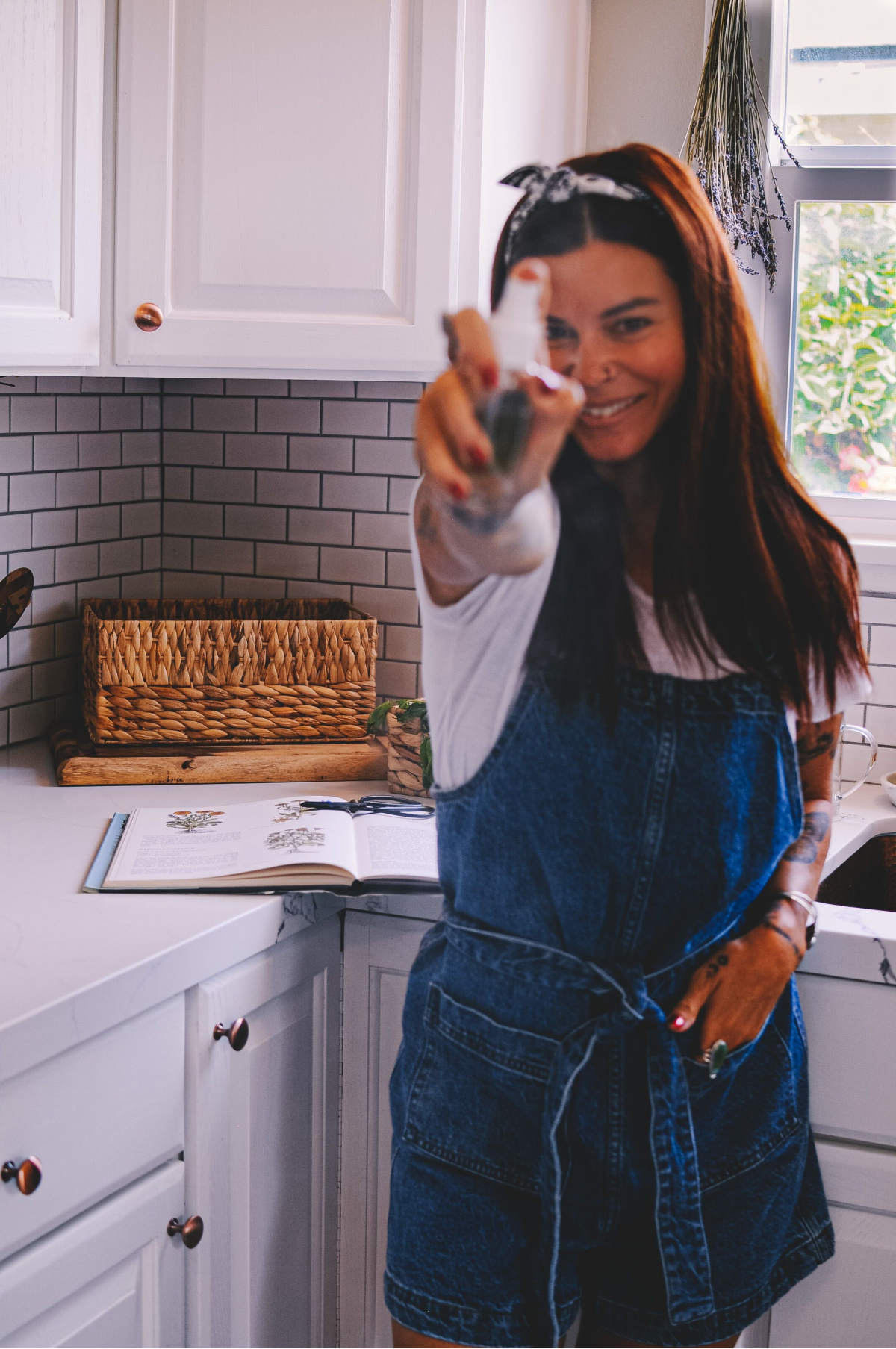 woman spraying mint spritz at camera