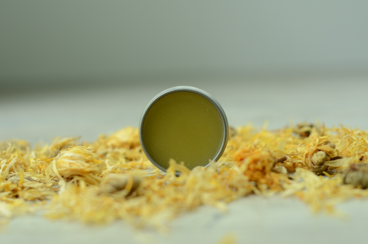 salve sitting on dried calendula flowers