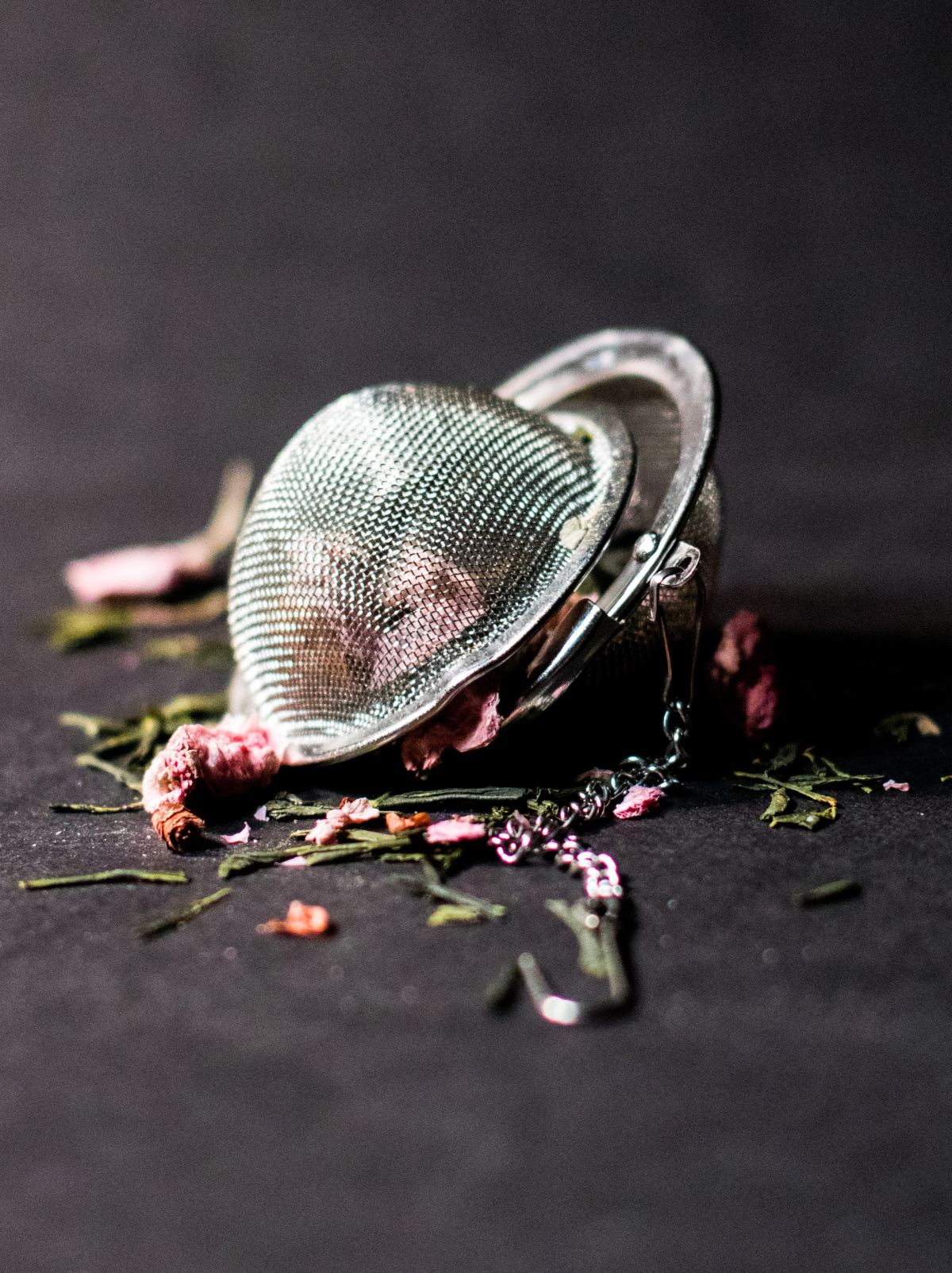 tea ball with dried herbs spilling out