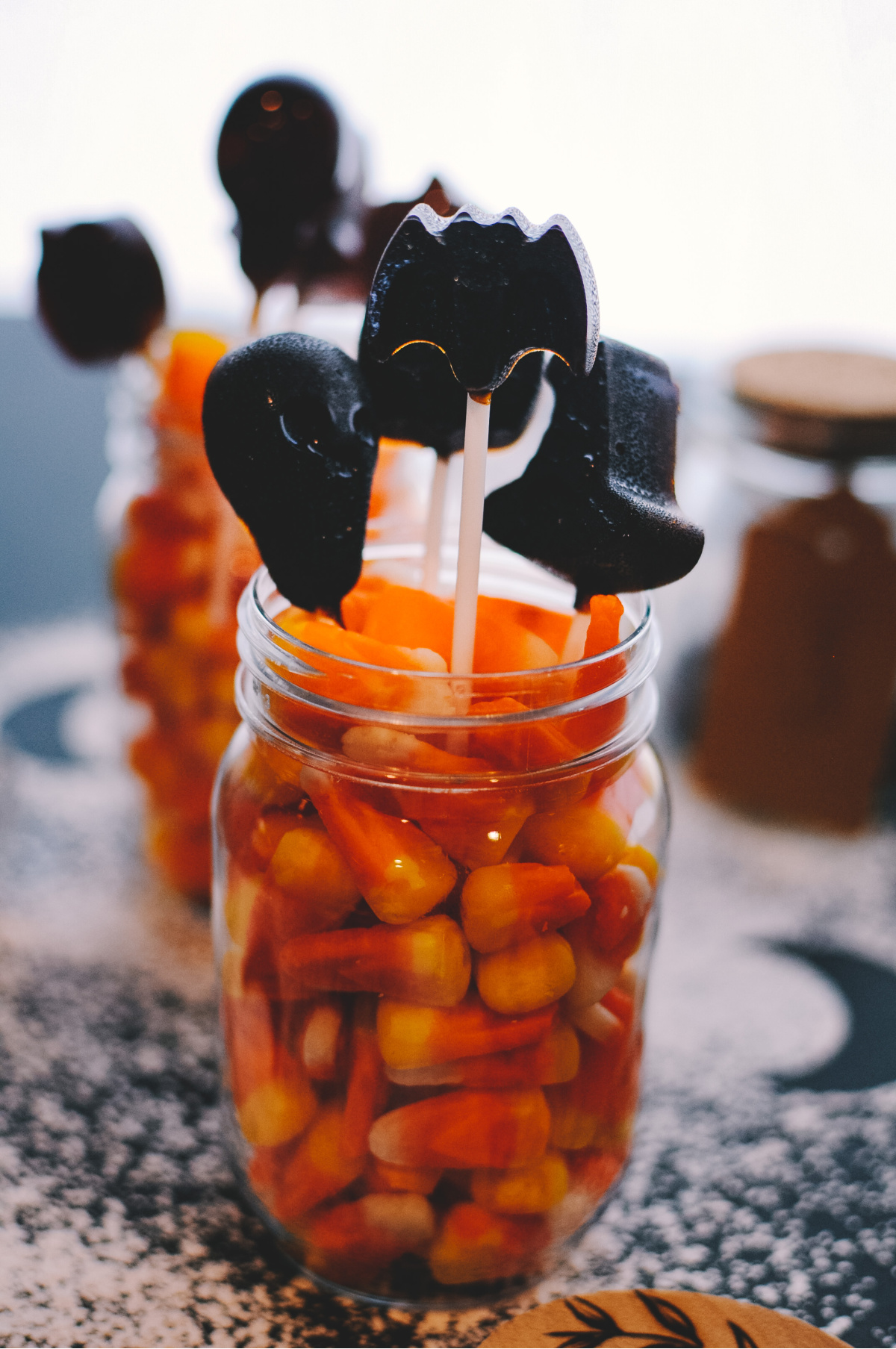 herbal lollipops in a jar with candy corn