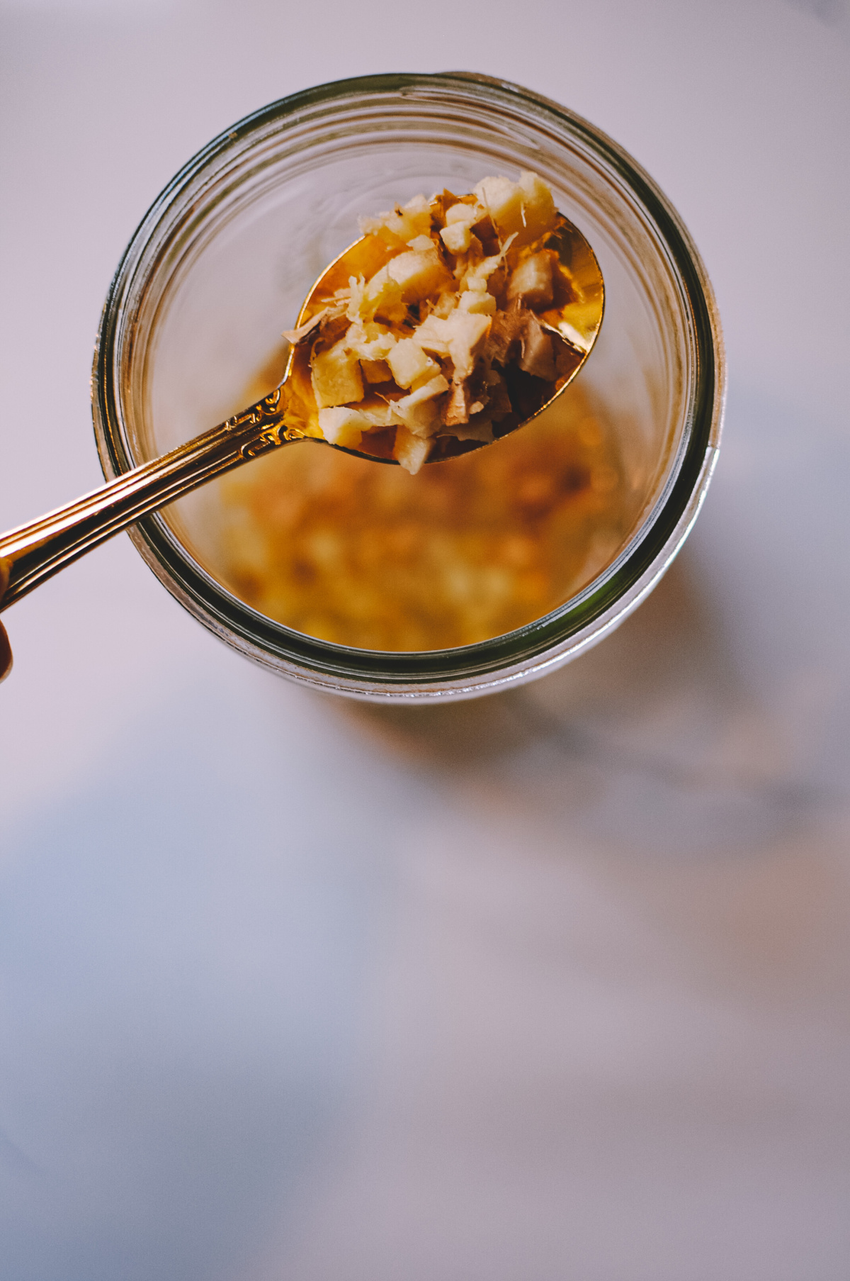 chopped ginger on a spoon