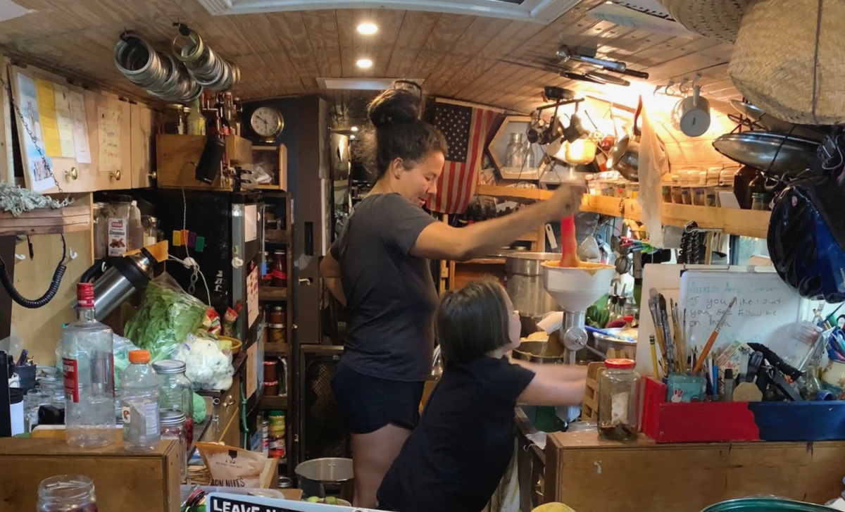 Shiang-ling cooking in self-covered bus