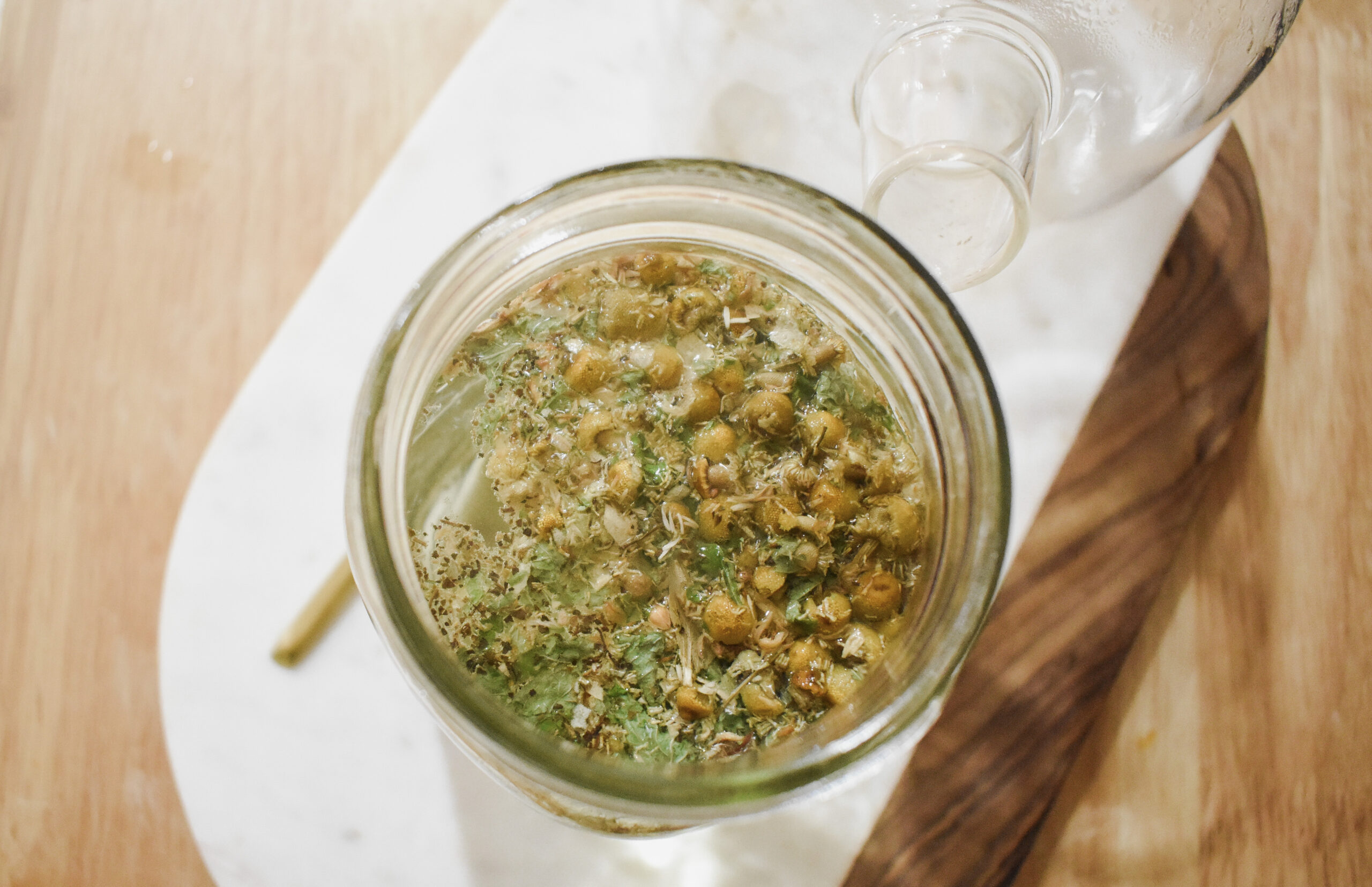 chamomile steeping in a jar