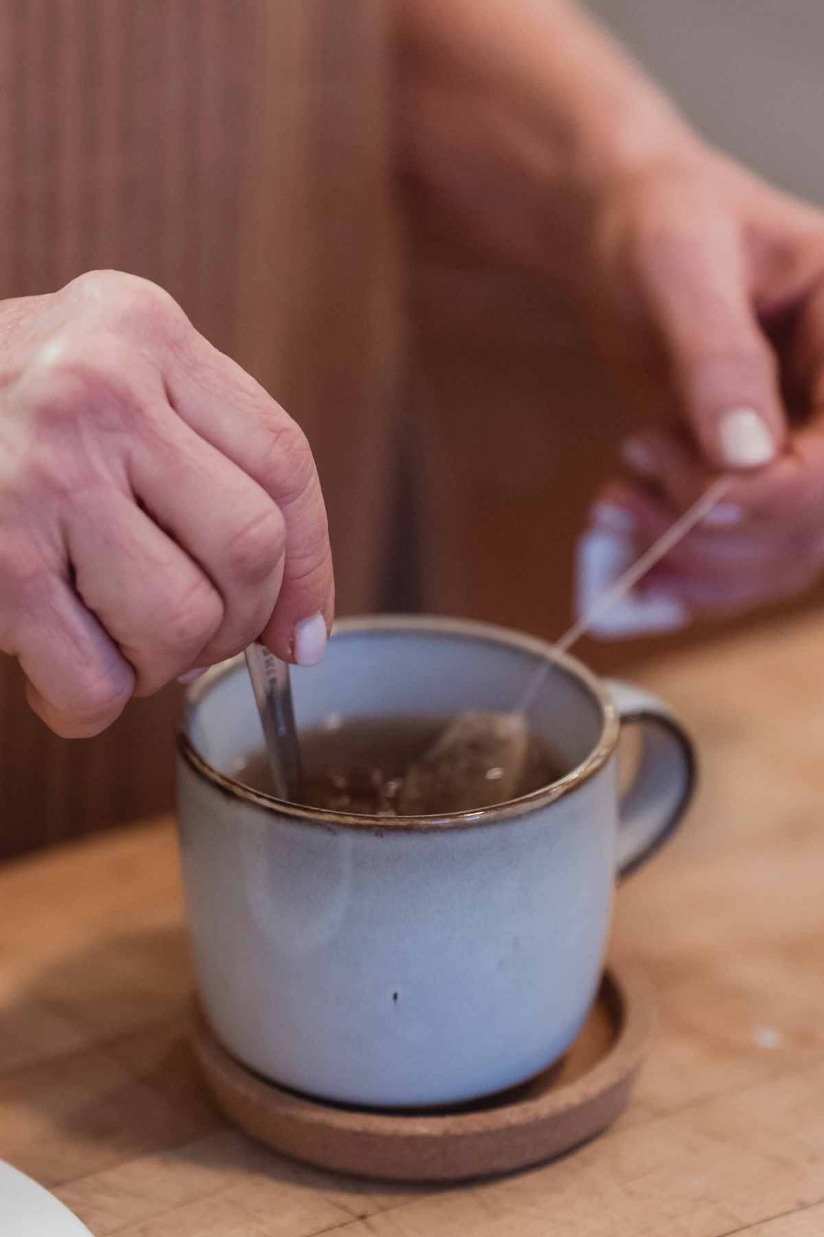 woman stirring a cup of tea