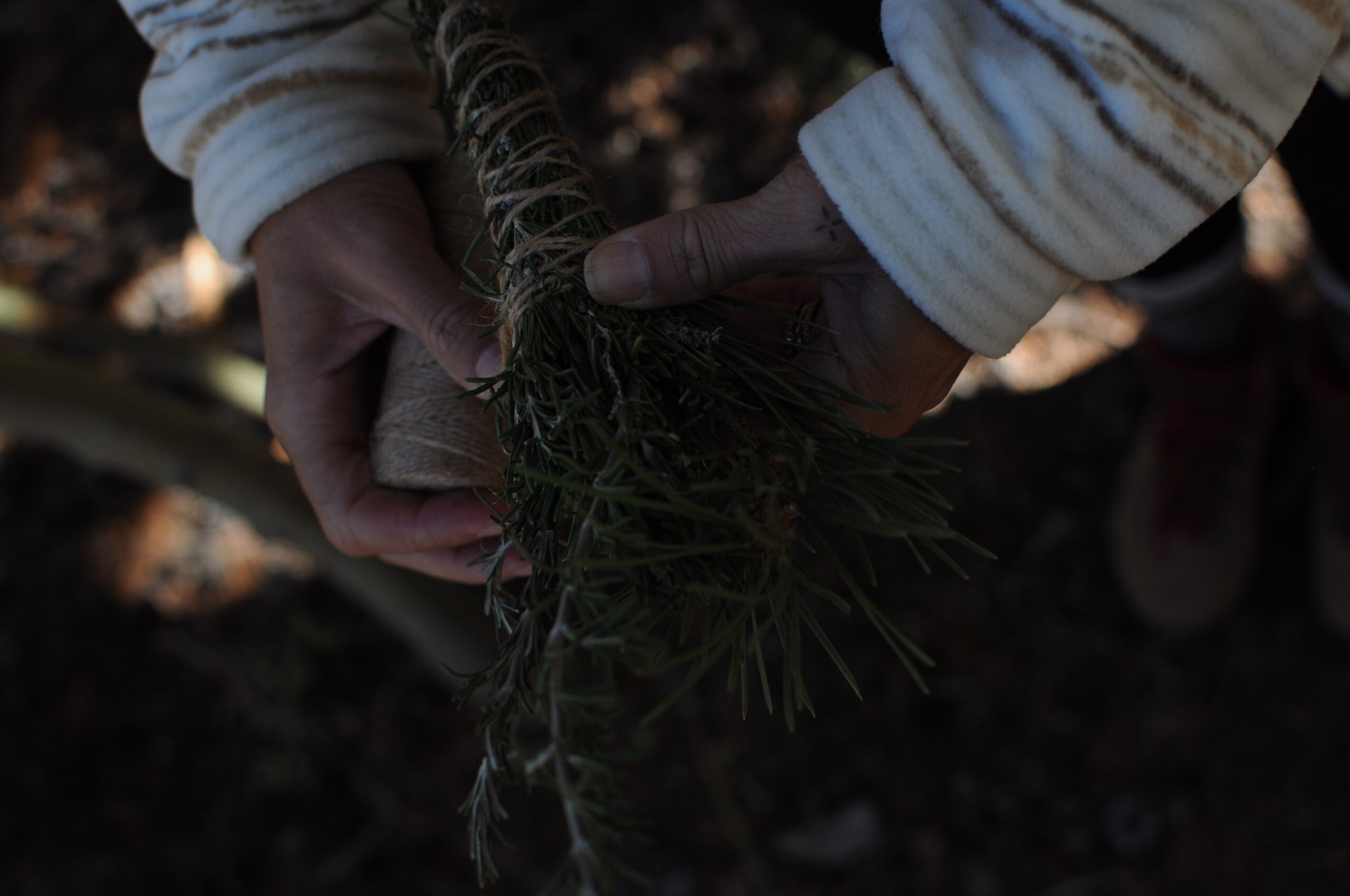 wrapping twine around a plant wand