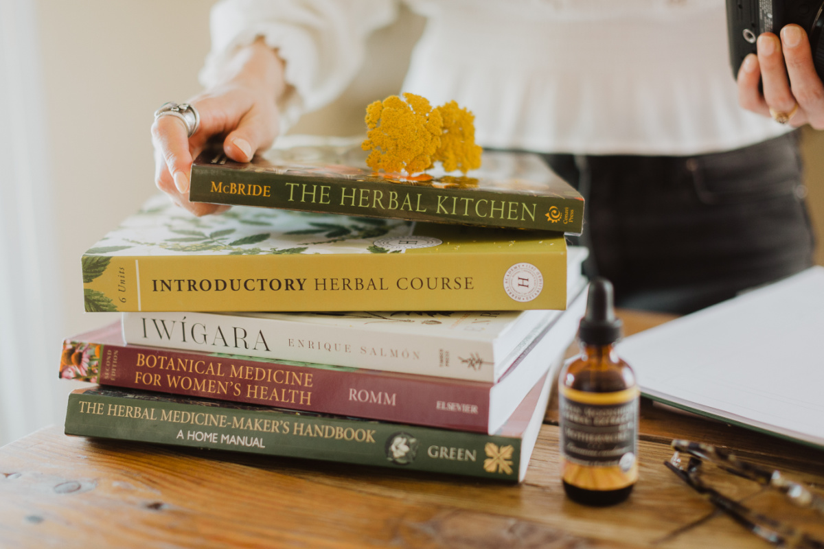 stack of herbal books