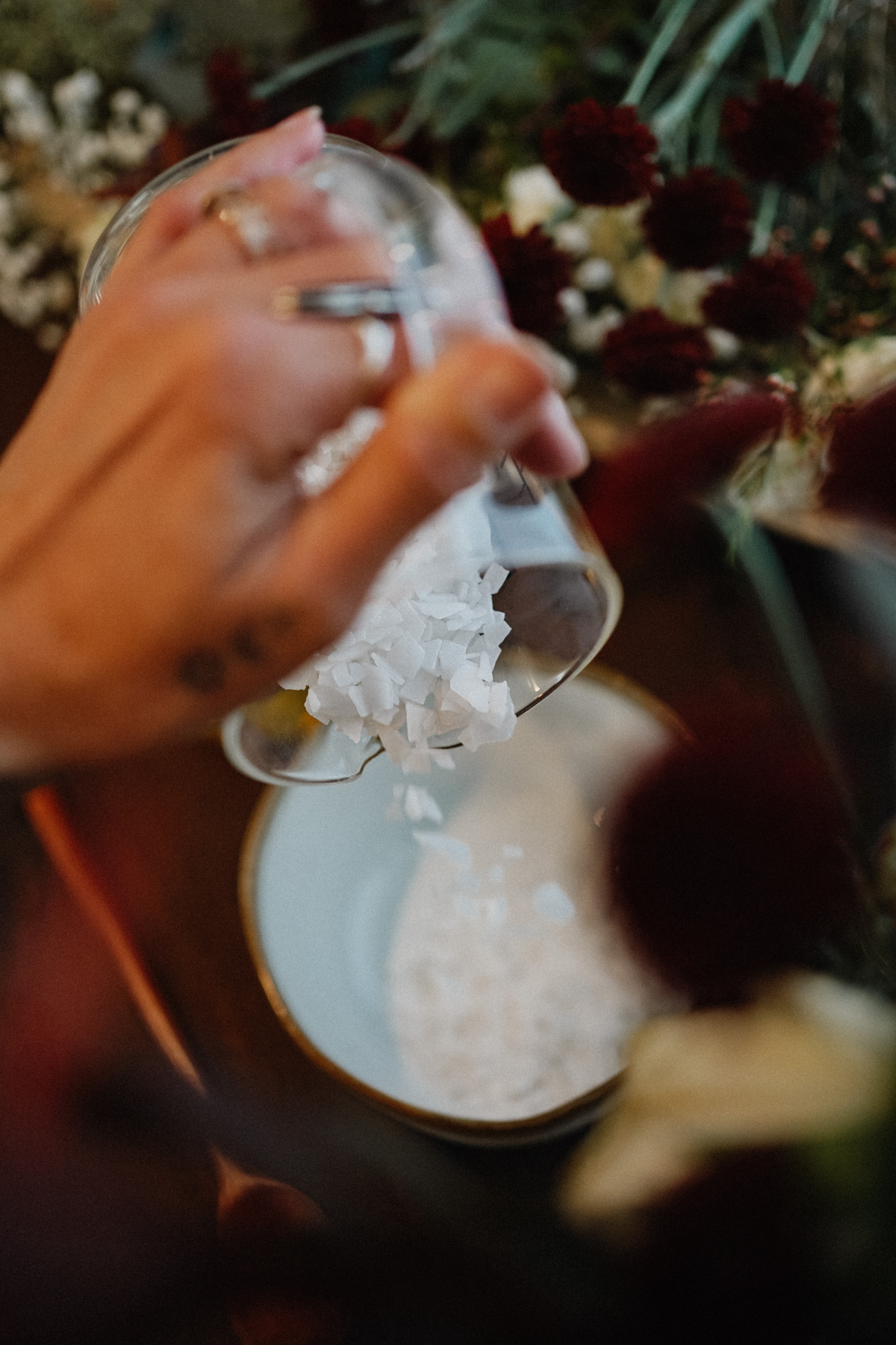 pouring magnesium flakes into a bowl