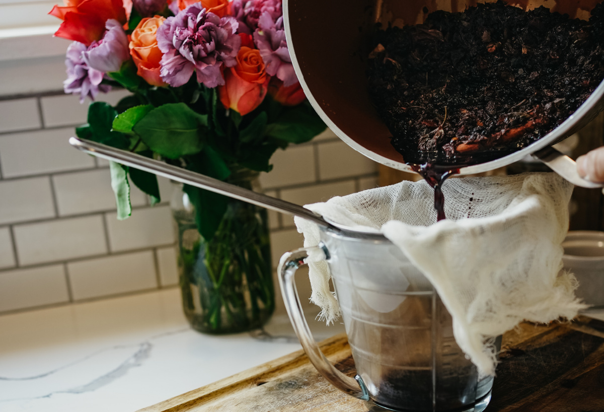 pouring health tonic herbs into cheesecloth