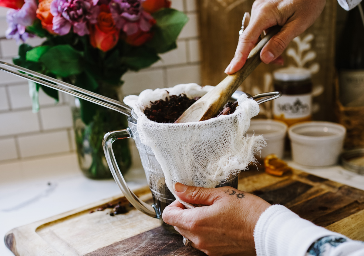 straining herbs for health tonic