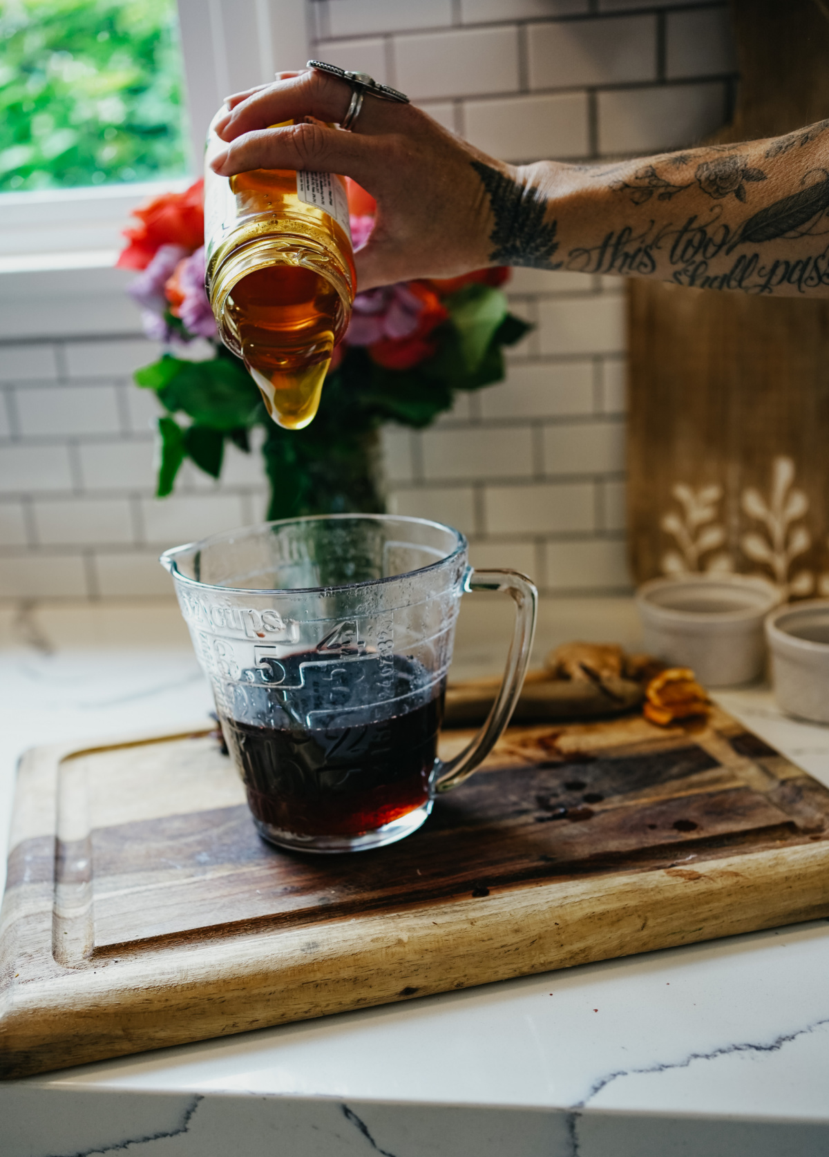 pouring honey into syrup