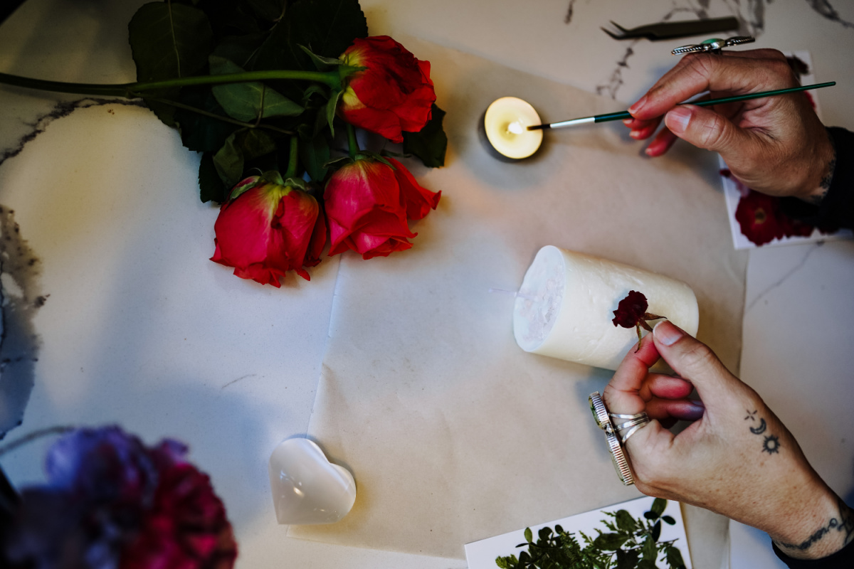 painting flower onto candle