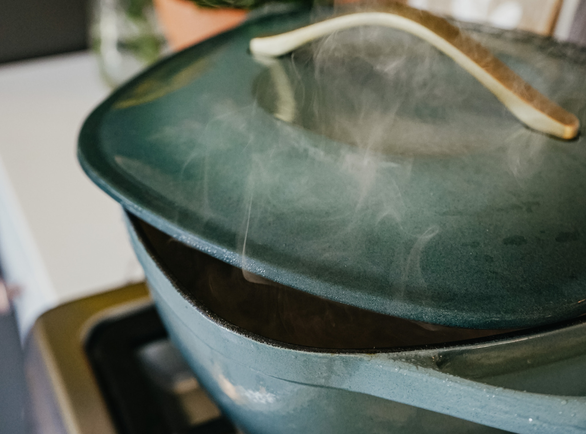 steam coming out of a pan with a lid