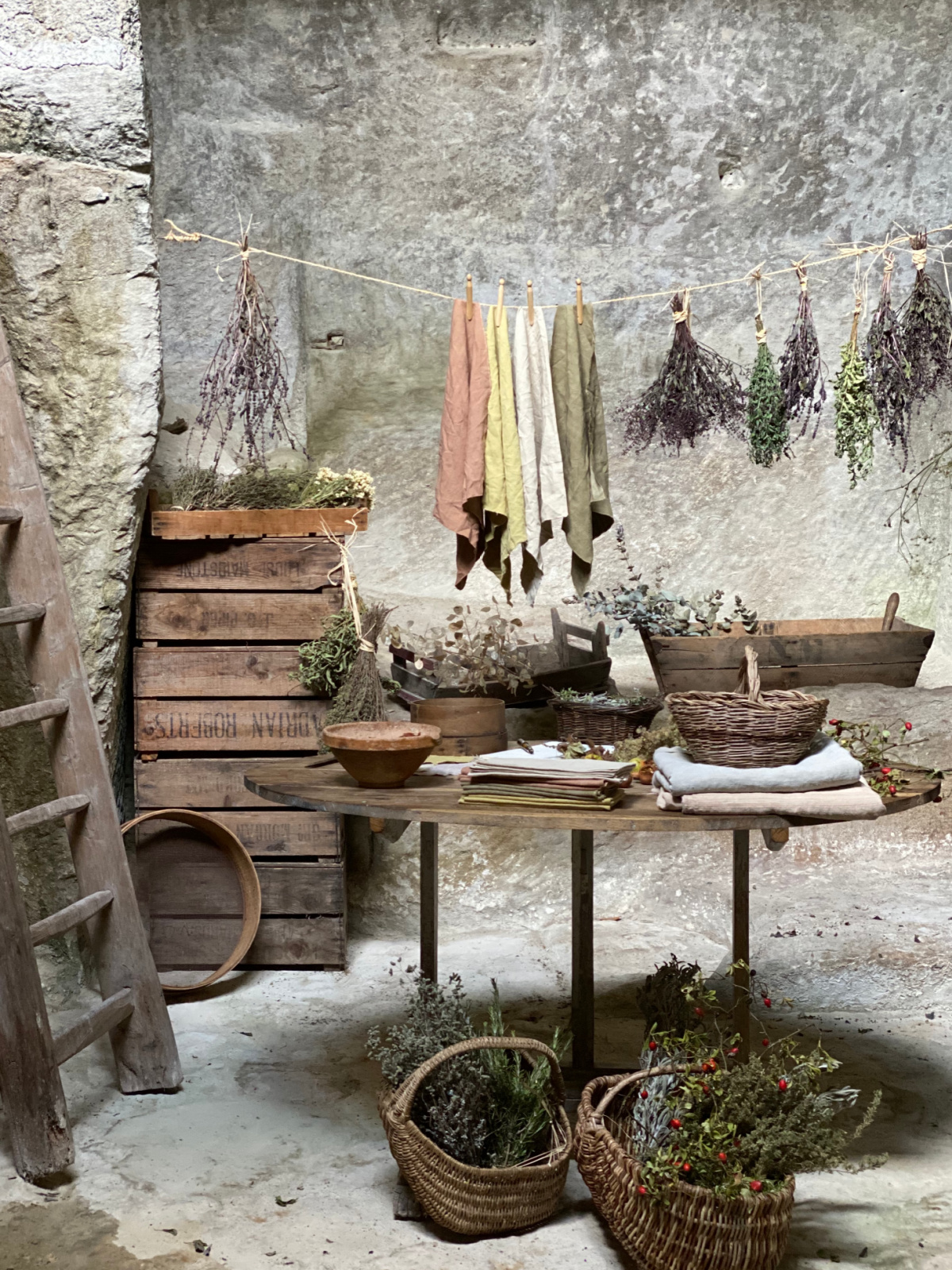 drying herbs and dyed cloths on a line