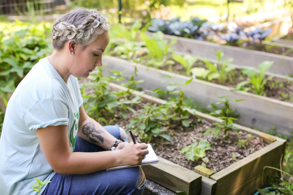 gardener taking notes of plants