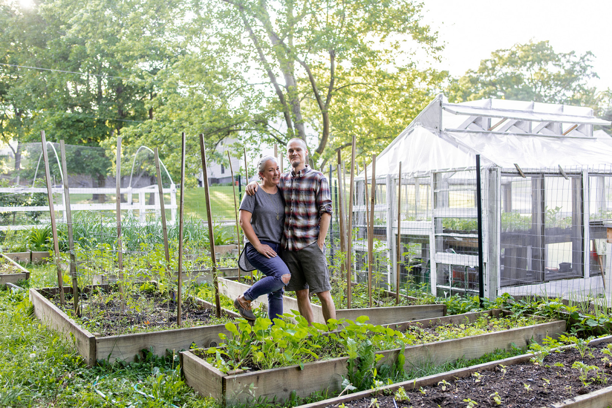 Shannon and husband standing in herb garden